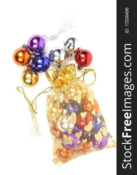 Christmas colorful balls in golden bag, on white. Christmas colorful balls in golden bag, on white