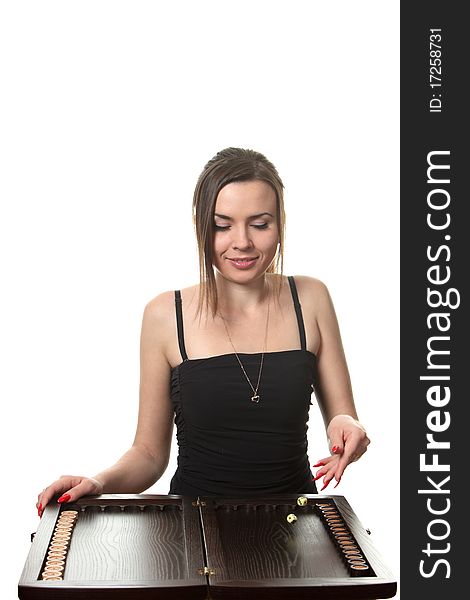 Young woman play a backgammon. Young woman play a backgammon