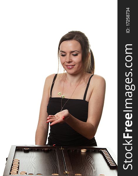 Young woman play a backgammon. Young woman play a backgammon