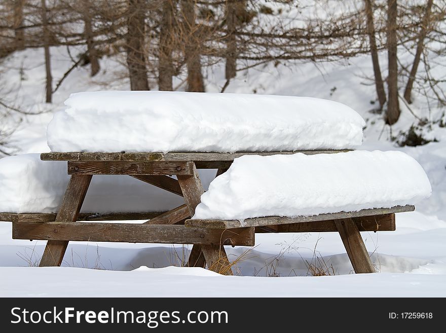 Picnic wooden table after a big snowfall. Picnic wooden table after a big snowfall