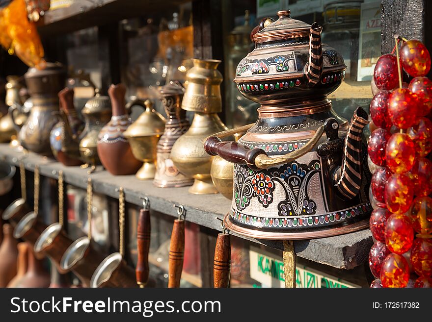 Bronze and copper handcrafted cookware in street shop. Shaki, Azerbaijan.