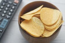 Close Up Of Chips In A Bowl With Tv Remote Stock Image