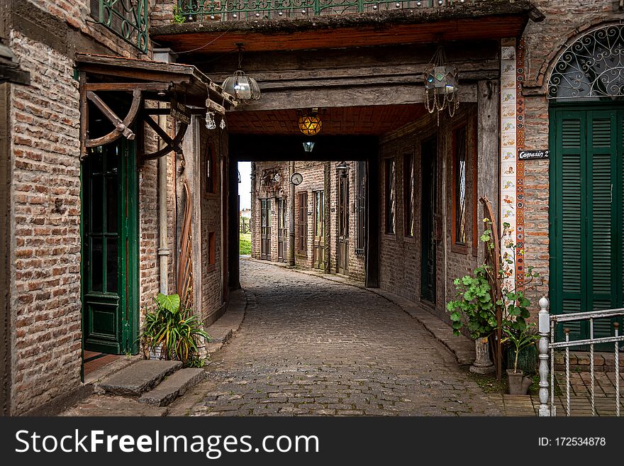 GONZALEZ CATAN, ARGENTINA, SEPTEMBER 28, 2019: cobblestone corridor through abandoned buildings in the amazing medieval town of