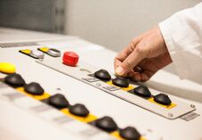 Hand Pushing The Button On The Control Panel Stock Image