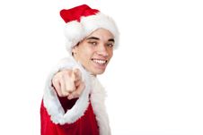 Teenager Dressed As Santa Claus Points With Finger Royalty Free Stock Images