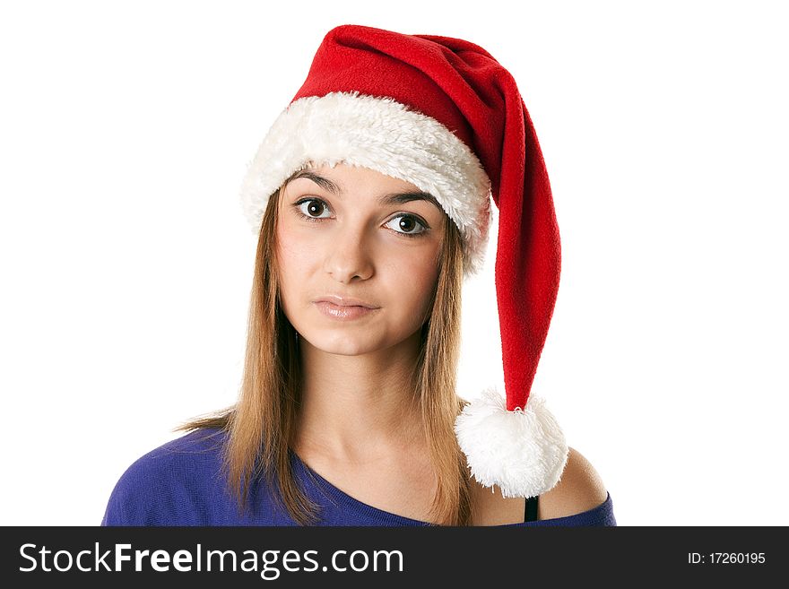 Beautiful girl in red Santa hat on a white background