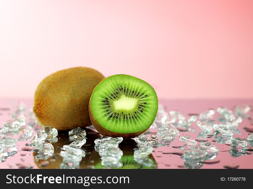 Kiwi and pieces of ice on the mirror surface