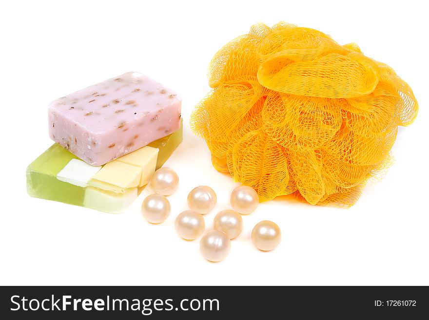 Green, purple and yellow fruit soap washcloth on white background