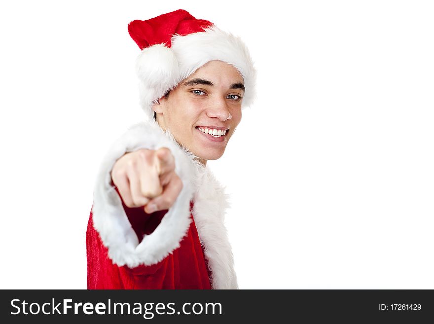 Smiling male teenager dressed as santa claus points with finger. Isolated on white background.