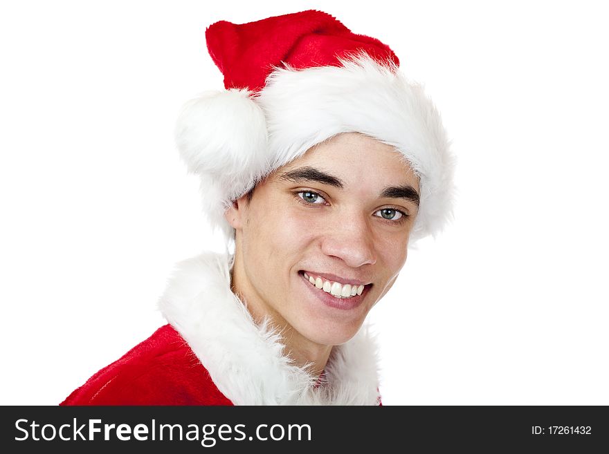 Attractive male teenager dressed as santa claus smiles happy. Isolated on white background. Attractive male teenager dressed as santa claus smiles happy. Isolated on white background.
