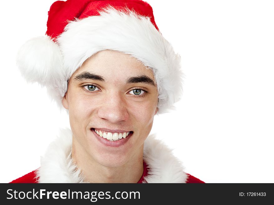 Attractive male teenager dressed as santa claus smiles happy. Isolated on white background. Attractive male teenager dressed as santa claus smiles happy. Isolated on white background.