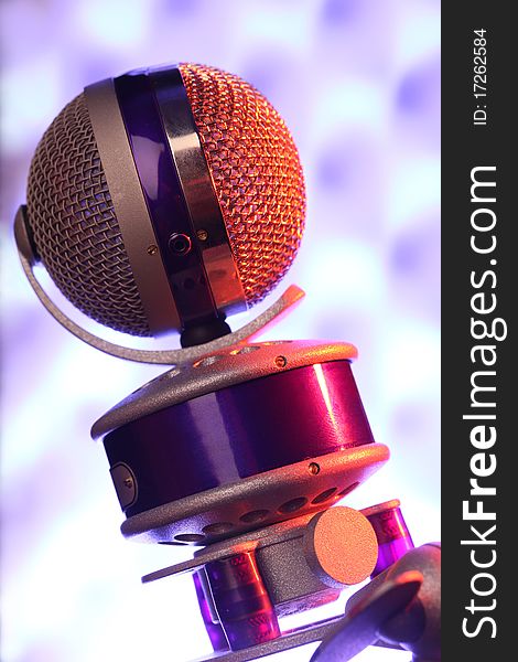 Modern violet microphone against sonic foam. Modern violet microphone against sonic foam