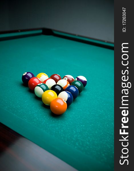 Billiard table and balls. Focus on balls.