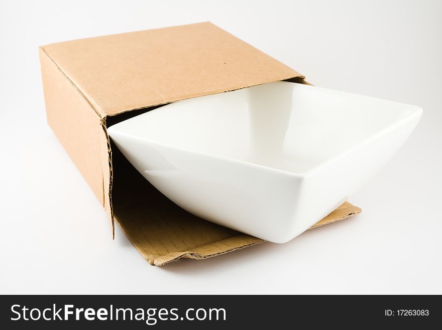Dish in Cardboard Box isolated on a white background