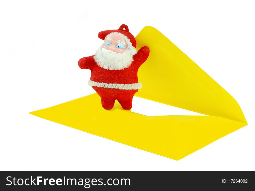Santa Claus figurine opening a letter. Santa Claus figurine opening a letter