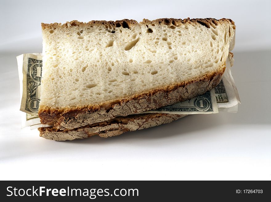 Two slices of bread with half of the money. Two slices of bread with half of the money