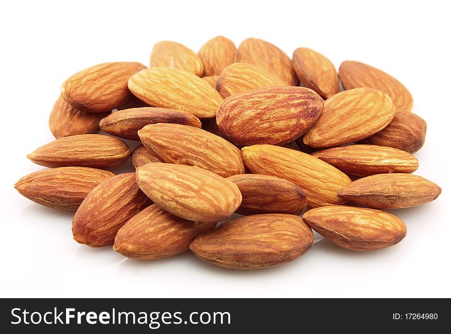 Group of dry almonds on a white background