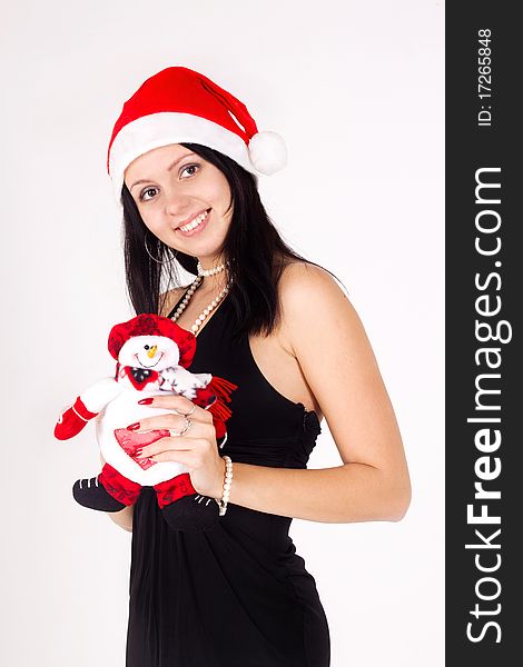 Santa girl  holding a snowman.
