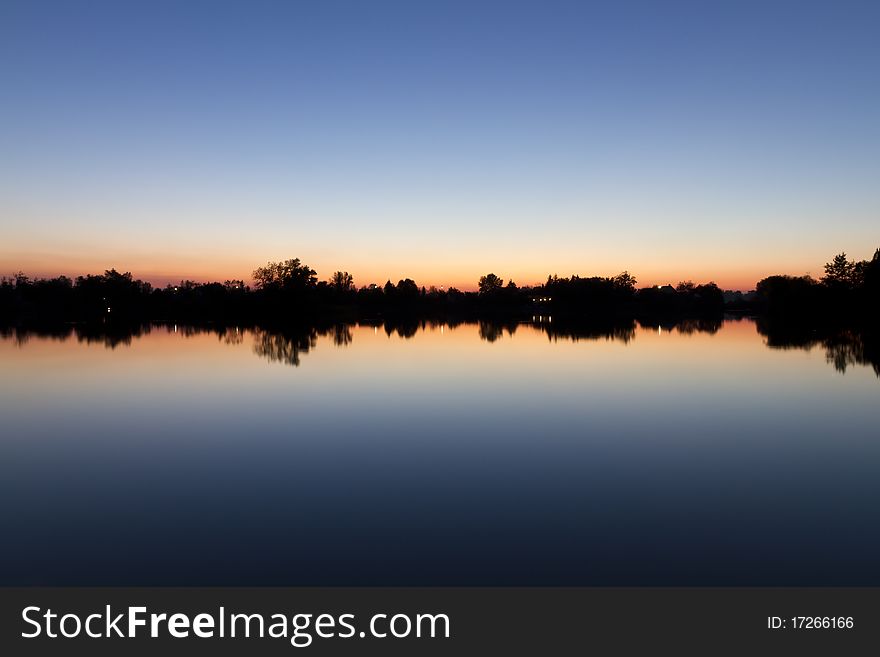 Sunset at the lake coast