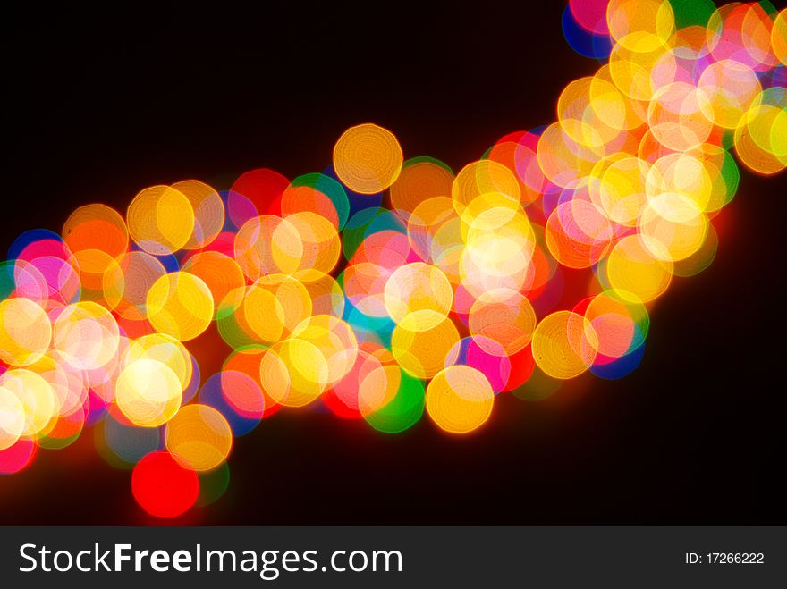 Abstract christmas lights as background on black