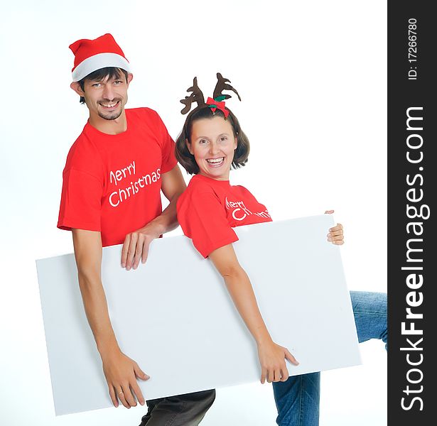 Isolated happy christmas couple with banner
