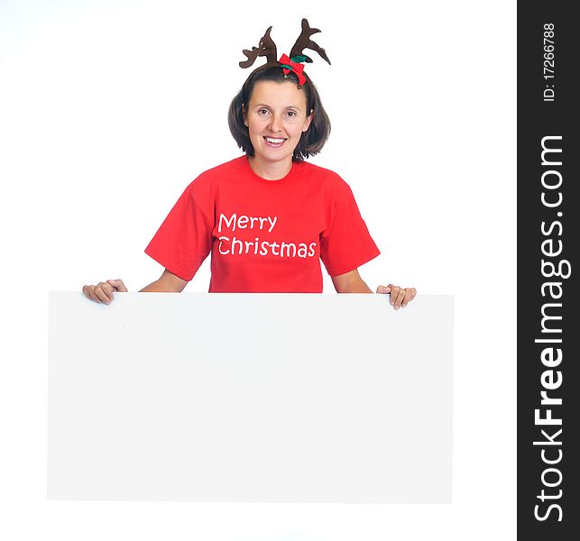 Isolated happy christmas woman looking at a blank sign