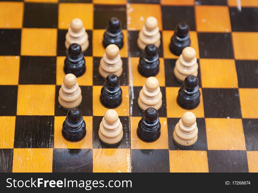 Isolated chess figures on playing feild