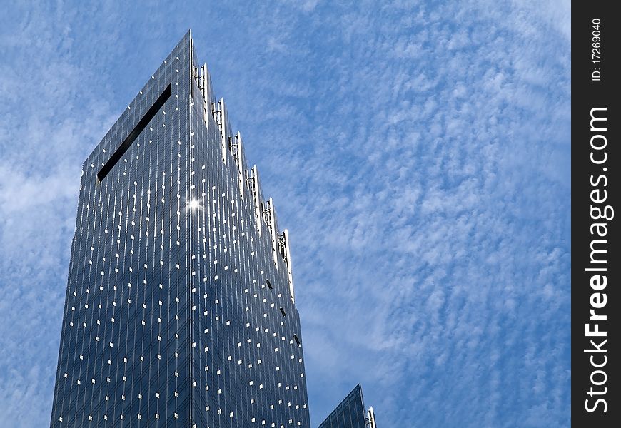 Glass reflecting skyscraper with copyspace