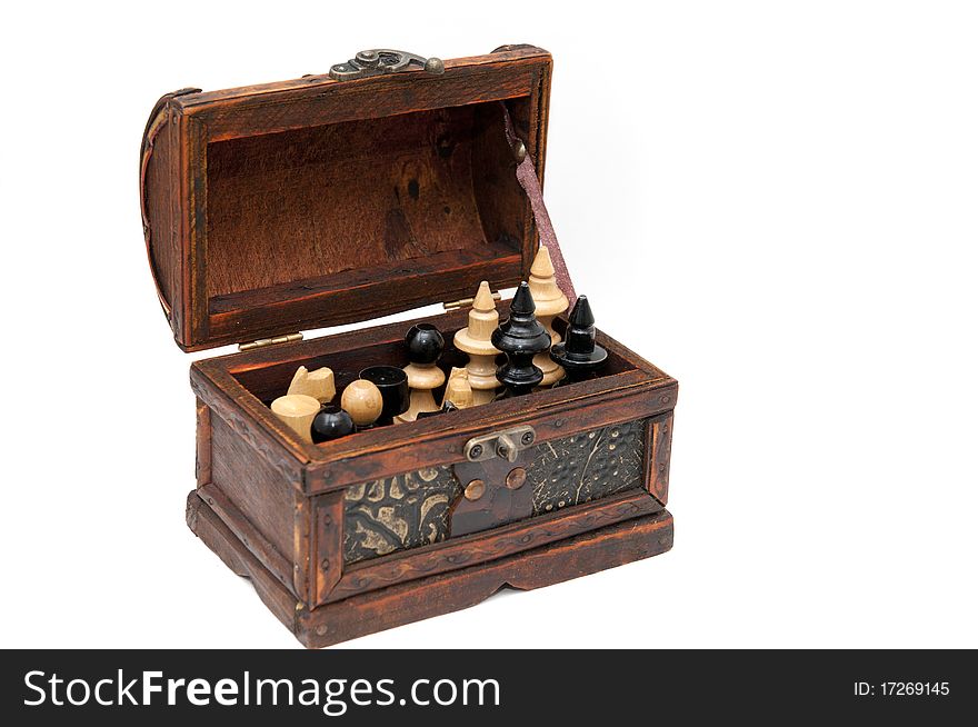 Old box with chess figures on white background