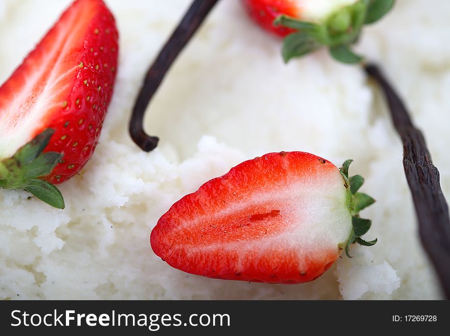 Strawberries and vanilla closeup in white