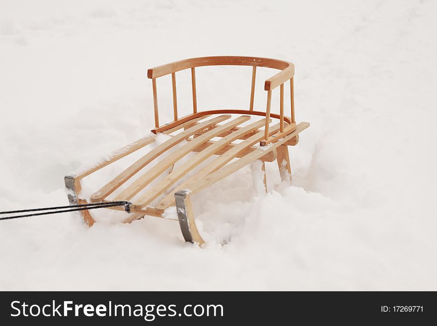 Wooden sled on the snow. Winter 2010. Wooden sled on the snow. Winter 2010