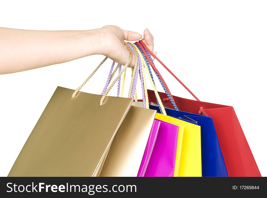Shopping bags in hand isolated on white