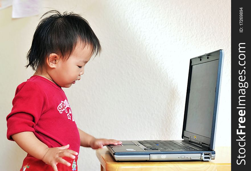 A little asia girl with laptop