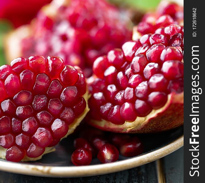 Pomegranate fruit, red pomegranate, close-up, macro close-up view of the red pomegranate grain. Juicy ripe red pomegranates or