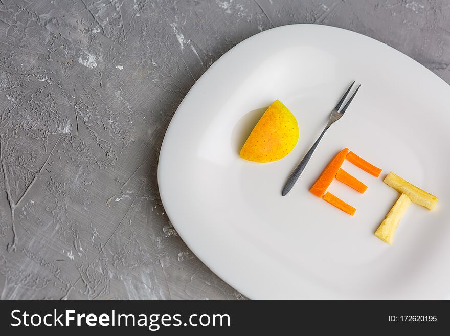 Fruit On A Plate Of Of Apple, Kiwi, Carrots, Nuts