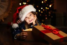 Cute Child Opening Magic Gift Box Near Christmas Tree Royalty Free Stock Photo