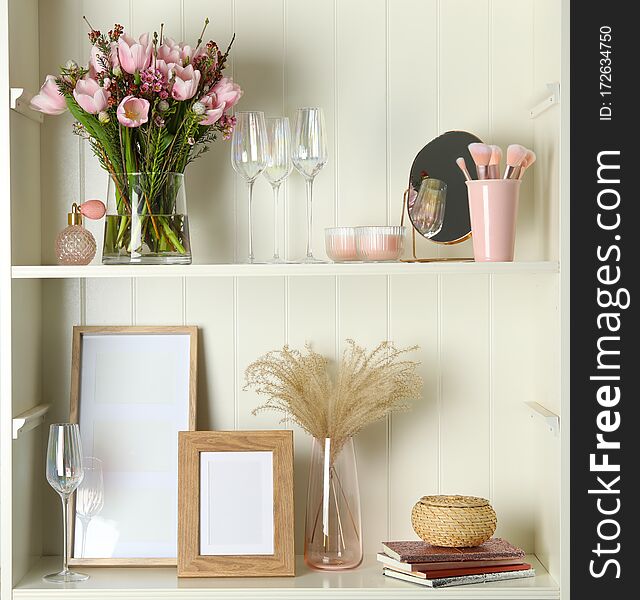 White Shelving Unit With Glassware And Decorative Elements