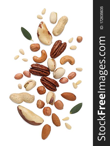 Different Delicious Nuts On White Background. Space For Text