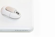 White Laptop With Cordless Mouse Royalty Free Stock Photography