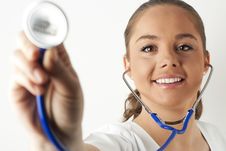 Young Woman Doctor Holding A Stethoscope Royalty Free Stock Photos Young Woman Doctor Holding A Stethoscope Royalty Free Stock Photos
