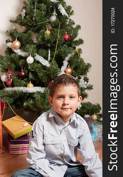 Boy near a new-year tree