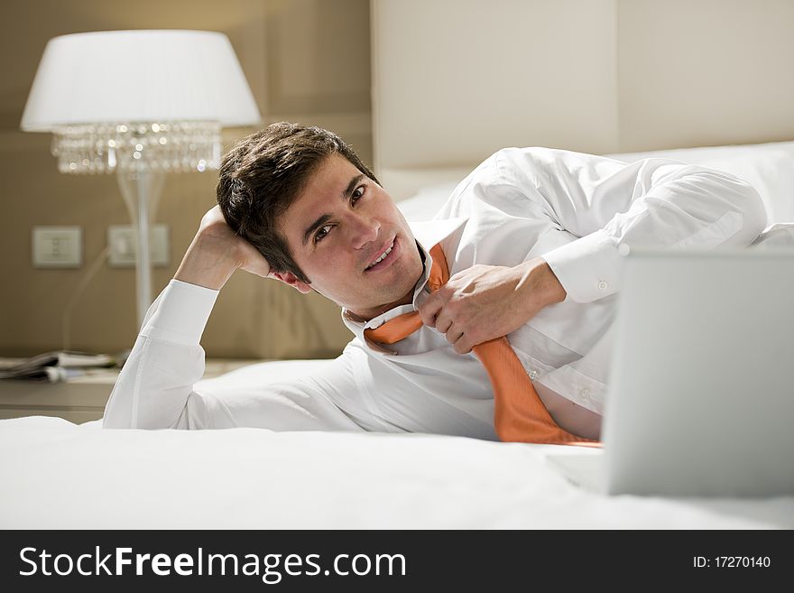 Relaxed businessman in a room hotel