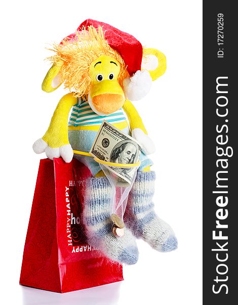 Toy lion as christmas gift on Santa Claus cap