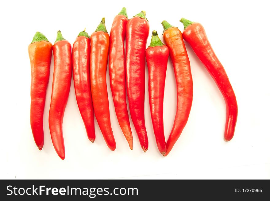Red and mildly spicy peppers from Mexico on white background. Red and mildly spicy peppers from Mexico on white background