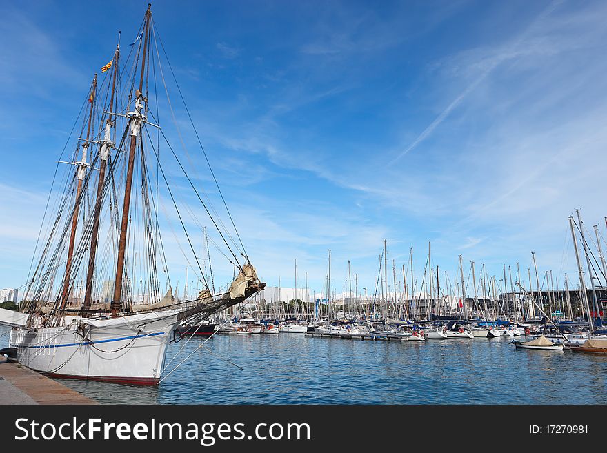 Sailboat in Barcelona harbor in september. Sailboat in Barcelona harbor in september.