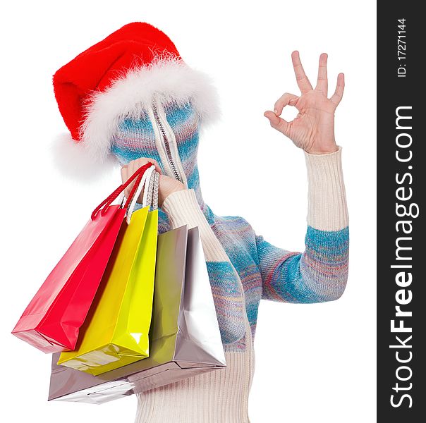 Portrait of a girl in cardigan with a hood with no face – Santa with shopping bags. Portrait of a girl in cardigan with a hood with no face – Santa with shopping bags