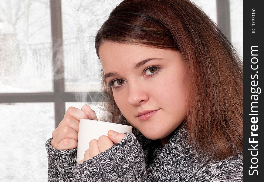 Portrait of happy beautiful teenage girl holding cup of hot coffee or tea. Portrait of happy beautiful teenage girl holding cup of hot coffee or tea