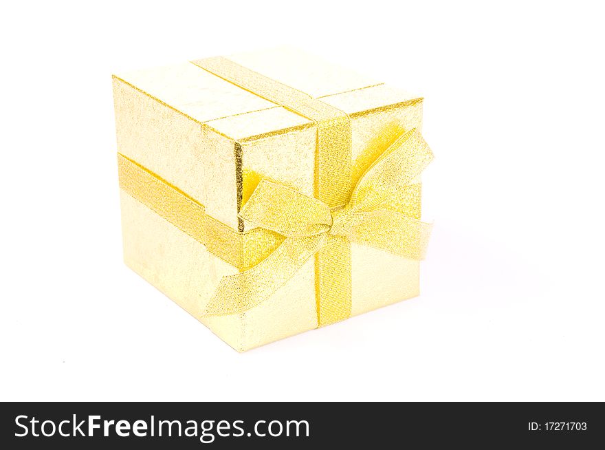 Christmas giftbox on white background, with golden ribbon