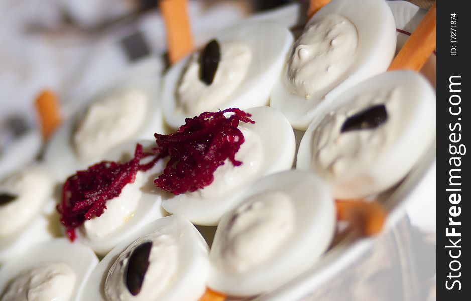 Egg appetizers with shredded beetroot. Selective focus.