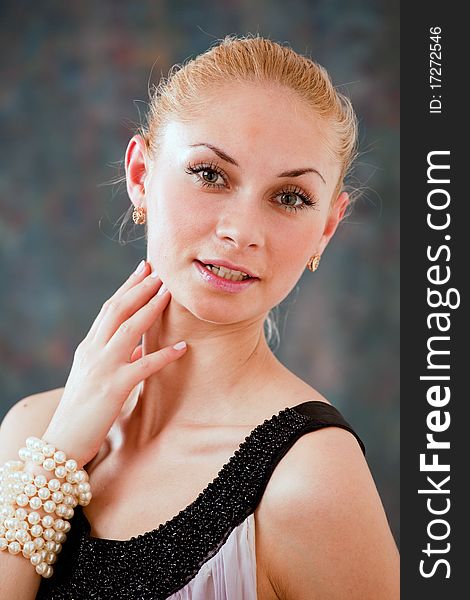 Lovely blonde female with pearl bracelet